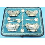 A Pearce & Sons cased set of four silver salts, with shaped garooned rims and semi-embossed