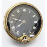 A North & Sons Ltd. brass cased automobile dashboard clock, with rear wind, pull out hand set tab