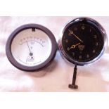 A Smith M. A. (N) dashboard clock with sprung winger set stem to base and black dial - sold with a