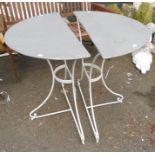 A pair of zinc topped demi-lune tables with painted wrought iron bases