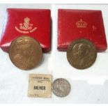 A cased 55mm bronze medal for the coronation of Edward VII, crowned face and text to obverse,