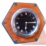 An automobile dashboard clock with front winder, set plunger (at forty minutes) set in a 1930's
