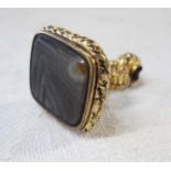 A hand chased ornate gold plated fob seal, set with agate panel