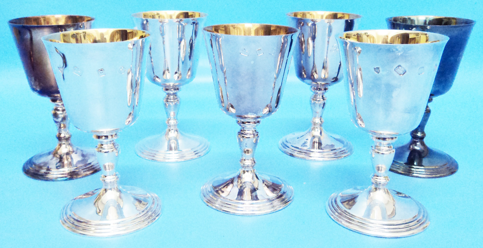 A seven matching silver goblets with parcel gilt interiors - all J. B. C. & Sons Ltd. - London 1977,