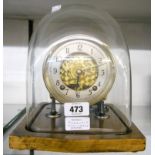 A 1930's Garrard eight day gong striking clock movement mounted on anodised steel supports, set on a