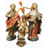 A pair of carved and painted figures of Christ and the Virgin Mary - sold with a wooden figure of