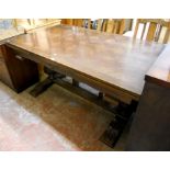 An early 20th Century oak draw-leaf refectory dining table with parquetry top, set on massive turned