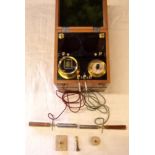 A vintage walnut cased Electro Shock Therapy machine