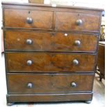 A 3' 6" 19th Century mahogany chest of two short and three long graduated drawers with turned wood