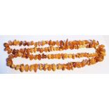 A long string of natural butterscotch amber beads