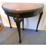 A 32" 19th century oak demi-lune fold over card table, with secret drawer to top of rear leg and