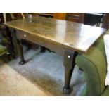 A 4' 9" 19th Century oak "ships table" with thick triple plank top, shaped frieze and single drawer,