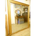 A 4' 19th Century French gilt framed overmantel mirror