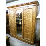 A 6' 3" Victorian mahogany compactum wardrobe, with rounded moulded cornice, slides, drawers and