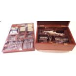 An oak canteen containing three fitted trays of Mappin & Webb silver plated cutlery, also containing