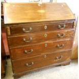 A 3' 1" early 19th Century mahogany bureau with inlaid fan pattern to fall, fitted interior and four