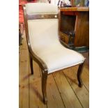 A pair of Edwardian inlaid mahogany framed curved back boudoir chairs, set on sabre front legs