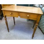 A 32 1/2" Victorian satin birch side table with two frieze drawers, set on turned legs