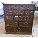 A 16 1/2" 19th Century Chinese multi-drawer chest, with applied embossed metal figures, animals
