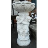 A 3' 2" reconstituted stone fountain with acanthus leaf pattern bowl, supported by three putti