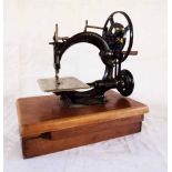 A Willcox & Gibbs Sewing Machine Co., New York, London, Paris, chain stitch sewing machine, set on