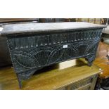 A 36" 18th Century oak coffer with later carved decoration - sold with two elm seated chairs