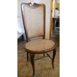 A set of four Edwardian inlaid stained beech framed bedroom chairs, with rattan panel high backs and