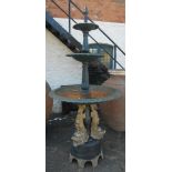 An 8' high cast iron three tier fountain with egg and dart decoration to rims, set on a pedestal