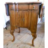 A 20" early  Georgian style walnut and cross banded drop-leaf side cabinet, with serpentine front