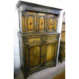 A 3' 6" early 20th Century oak court cupboard, with carved frieze and three inlaid and panelled