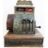 An early 20th Century cast bronze National cash register with neoclassical decoration, German text
