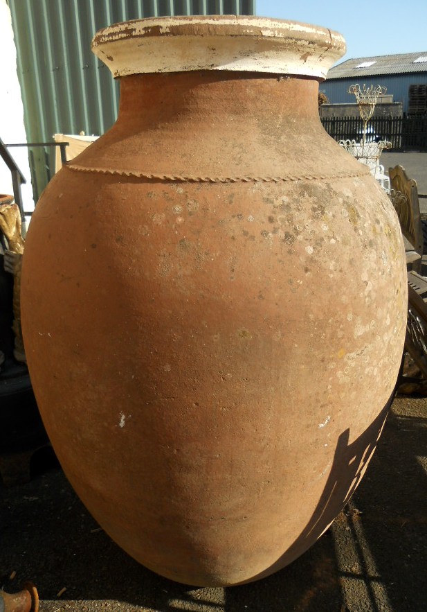 A 4' 9" old Spanish terracotta olive oil jar - circa late 19th Century