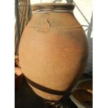 A 4' 11" high Spanish terracotta olive oil jar, stamped Francisco Chamizo Peguero, Majadas - 1896