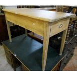 A 4' 3" Victorian scrub-top pine kitchen table with single drawer, set on square tapered legs