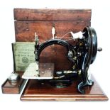 A Willcox & Gibbs "Automatic" sewing machine, complete with manual, oil can, etc. - serial number