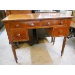 A 3' 3" Victorian mahogany knee-hole desk, with four drawers, set on turned legs