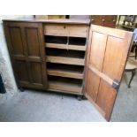 A 3' 6" Victorian oak linen press with two short drawers and four slides enclosed by a pair of