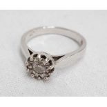 An 18ct. white gold illusion set diamond solitaire ring - 0.2ct.
