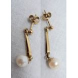 A pair of 9ct. gold pendant ear-rings, set with cultured pearl drops