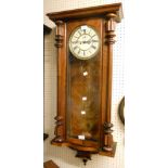 A late 19th Century walnut cased Vienna style regulator wall clock, with flanking half columns,