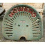 A vintage cast iron Howard K24 tractor seat with pierced lettering and decoration