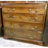 A 31" Georgian mahogany and oak lined bachelor's chest with brushing slide, four long graduated