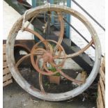 A 5' 6" diameter cast iron mill flywheel with 22" flywheel on same axle