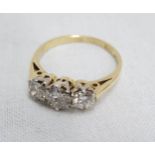 An 18ct. gold three stone diamond ring - London 1987