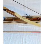 A long bow with a boxed set of wooden arrows - draw weight 35# @ 28"