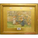 A gilt framed watercolour, depicting children with a puppy - initialled M. E. S. - 7½" x 10½"