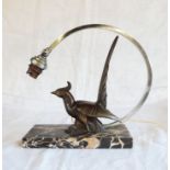 An Art Deco table lamp with stylised gilt spelter bird and curved branch pattern shade support