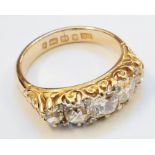 An 18ct. gold ring, set with five graduated diamonds - Birmingham 1883