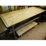 A 6' 1" antique French pine kitchen table, set on twin flanking pegged supports