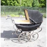 An early 20th Century carriage pram by Silver Cross, in black livery